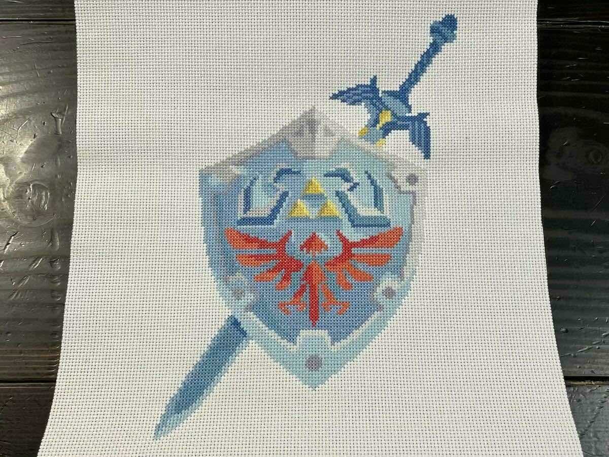 Hylian shield and master sword cross-stitch